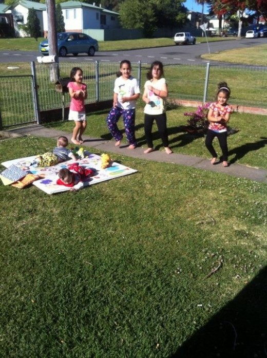 dancing 'gangnam style' to entertain the twins outside on a beautiful day