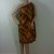 Tied on one shoulder for the toga look. Tied on one shoulder for the toga look.