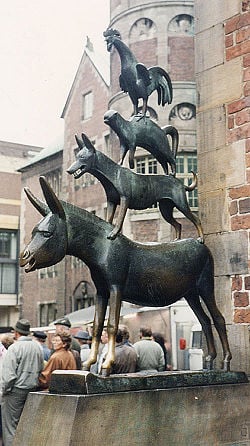 "A bronze statue depicting the Bremen Town Musicians located in Bremen, Germany. The statue was erected in 1953. Note the front hooves that have become shiny. Touching the front hooves is said to make wishes come true."  http://en.wikipedia.org/wiki/