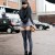 Beautiful Japanese woman wearing a street fashion attire rather well with black stockings that raise up her thighs to just beneath her gray skirt. Beautiful Japanese woman wearing a street fashion attire rather well with black stockings that raise up her thighs to just beneath her gray skirt.