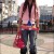 Cute Asian woman wearing jeans, pink belts and light pink short cut shirt with a dark pink handbag. Cute Asian woman wearing jeans, pink belts and light pink short cut shirt with a dark pink handbag.