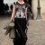 Woman walking the streets with a t shirt that has print of wolf and black pants. Woman walking the streets with a t shirt that has print of wolf and black pants.
