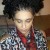 Vichnacova model wearing a braided Afro with zebra colored blouse and red scarf, long Bamboo earrings street style. Vichnacova model wearing a braided Afro with zebra colored blouse and red scarf, long Bamboo earrings street style.