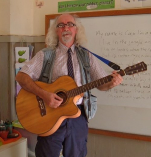 Bard of Ely sings and plays to the class