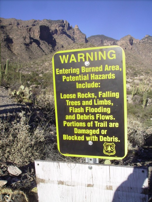 Sign at start of trail warning of debris from the Aspen fire that covered 84,730 acres and burned for a month in 2003 