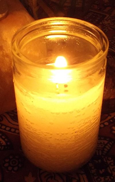 A candle on my table. Candles not only shed light, but symbolize (and help provide) wisdom and light to the situation being discussed.