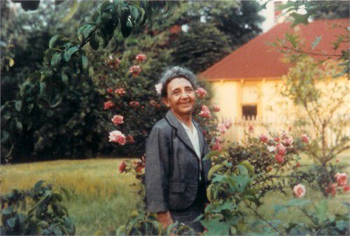 This is Babcia in the rose garden, in the back yard of the 200 year old house I grew up in, Staten Island, NY (Neighbor's workshop in background.)