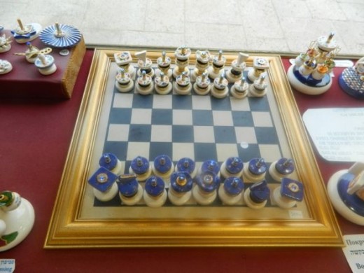 A chess set from spinning tops.
