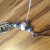 Thread the cord through your last bead (or a few beads) and gently ease everything together to tighten it. Thread the cord through your last bead (or a few beads) and gently ease everything together to tighten it.
