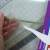 9. This shows the ribbon pulled through the slot. You'll also learn how to protect your artwork with a sleeve while you slide it into the cover. 9. This shows the ribbon pulled through the slot. You'll also learn how to protect your artwork with a sleeve while you slide it into the cover.