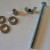 For each corner of the press you'll need a set of hardware. Shown, from left to right are three washers, a nylon threaded nut (tiny piece above the right washer), a wing nut, and a 3" hex bolt.
Check the description above for more details on select For each corner of the press you'll need a set of hardware. Shown, from left to right are three washers, a nylon threaded nut (tiny piece above the right washer), a wing nut, and a 3" hex bolt.Check the description above for more details on select