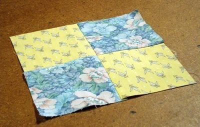Completed Four Patch block in contrasting fabrics