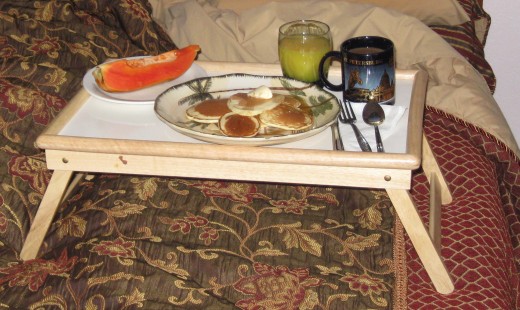 Pancakes, papaya, juice and coffee ready to serve my wife breakfast in bed.