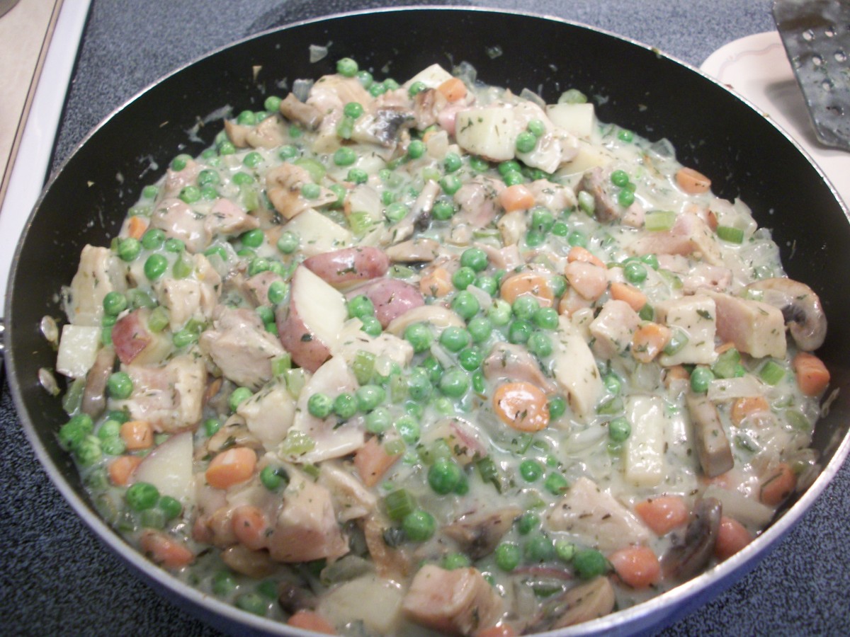 Once you reduce heat, add the peas, chicken, salt and pepper and combine well.