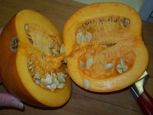 Cut the pumpkin in half.