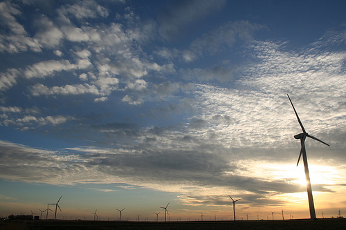 An Iowa wind farm at sunset. Photo by 2neus.