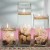 Floating candles with clear vase with rocks and a single orchid Floating candles with clear vase with rocks and a single orchid