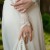 Bella's dress has a loop on the train, that she slips on her wrist at the reception. Bella's dress has a loop on the train, that she slips on her wrist at the reception.