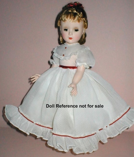 This was a typical dress for a doll in 1948.  Yes, there were baby dolls.  They came with a cloth diaper and a whole in their mouth to either suck their thumb or stick the bottle in.  No real fluid was used, and they hadn't come up with the false liq