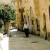 Orthodox Jew walking down the Jewish Quarter in the Old City of Jerusalem. You can see the typical dress of an Orthodox Jew with Tzit Tzit (the strings hanging down), Peyos (side curls, and Yarmulk or Kippa. Orthodox Jew walking down the Jewish Quarter in the Old City of Jerusalem. You can see the typical dress of an Orthodox Jew with Tzit Tzit (the strings hanging down), Peyos (side curls, and Yarmulk or Kippa.