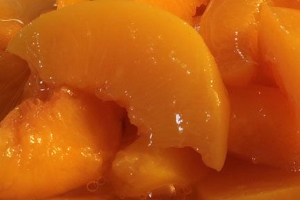 Close-Up Of Canned Peaches