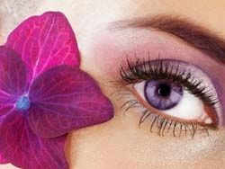 Girl wearing violet colored contacts