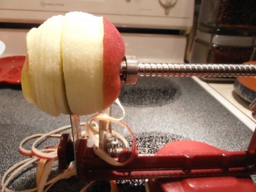 Use the apple peeler, corer, slicer to slice the apples.