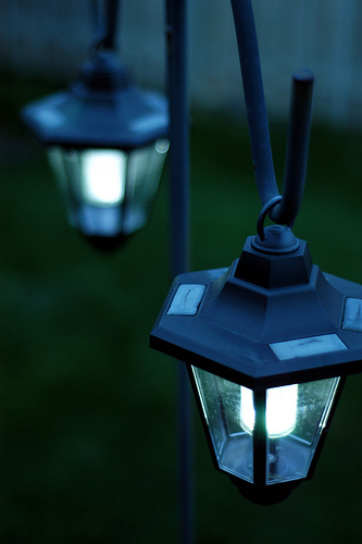 Solar-powered lanterns on a terrace, outdoors. Copyright Ian Muttoo @ Flickr