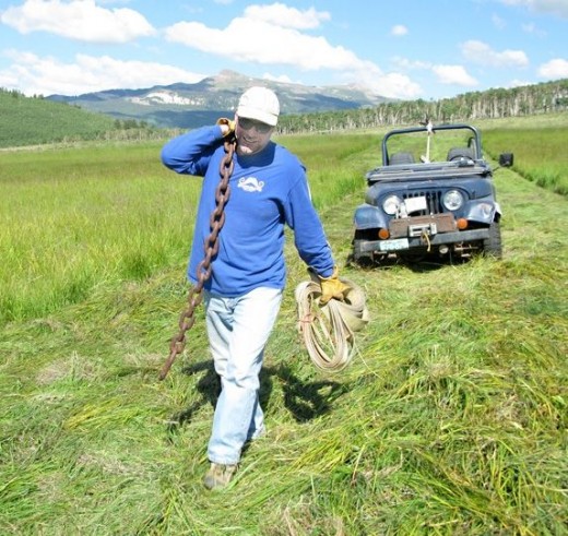 Jim works the hay fields in Lake City Colorado.