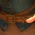 Smaller belt's belt loops (1 of 3), and larger belt buckle. Smaller belt's belt loops (1 of 3), and larger belt buckle.