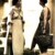 Two women in a background scene. The woman on the left has an outfit similar to Leonidas' mother's drapery dress, minus the drapes. Two women in a background scene. The woman on the left has an outfit similar to Leonidas' mother's drapery dress, minus the drapes.