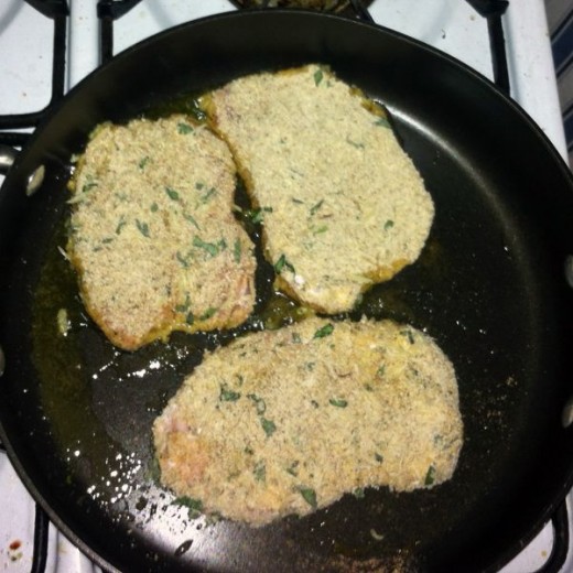Breaded with cheese &amp; herbs and cooking in a small amount of olive oil.