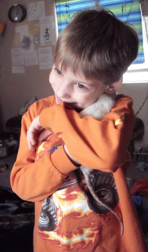 My little brother with his rat Starlight!
