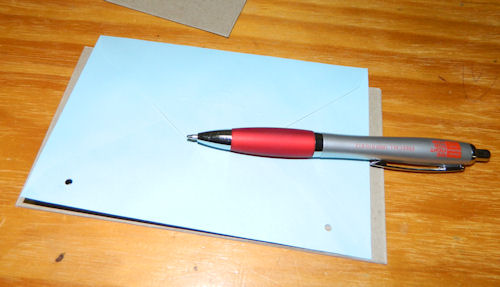 Use the page you punched first as a template to mark where the holes need to go on the other pages.