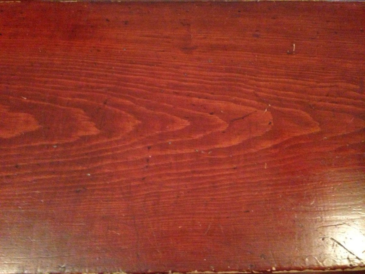 Wood grain on the slant top of the desk.