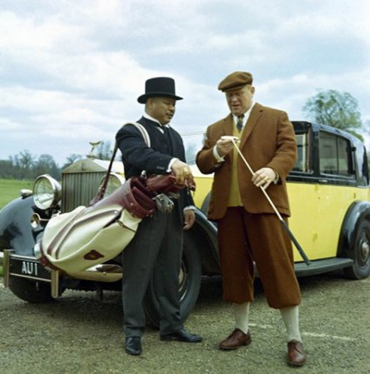 Oddjob (Harold Sakata) and Goldfinger (Gert Fröbe ) 