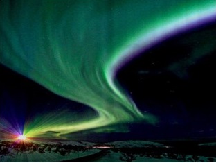 An aurora. Charged particles from the Sun emit light when they strike molecules in the upper atmosphere.