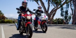 The CB300F is the red motorcycle in the foreground, while the CBR300R is the red, white, and blue, motorcycle in the background