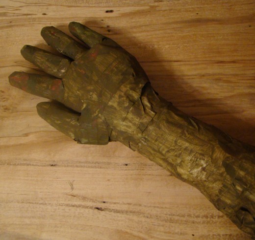 My son is in the process of making this scary hand and arm.  He used a medical glove, newspaper, a little paper mache, and tape.  He may add fake fingernails next.