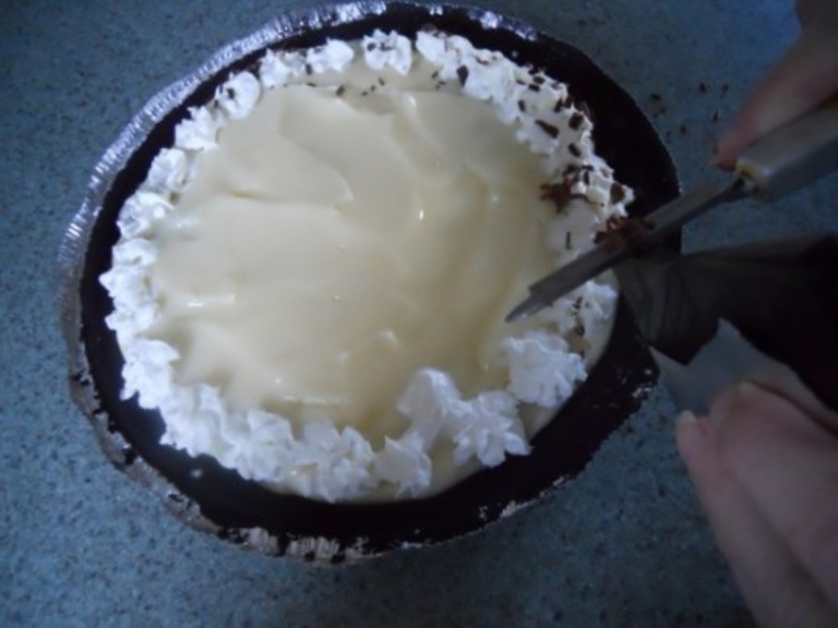 Shave pieces of chocolate around the pie onto the whipped cream.