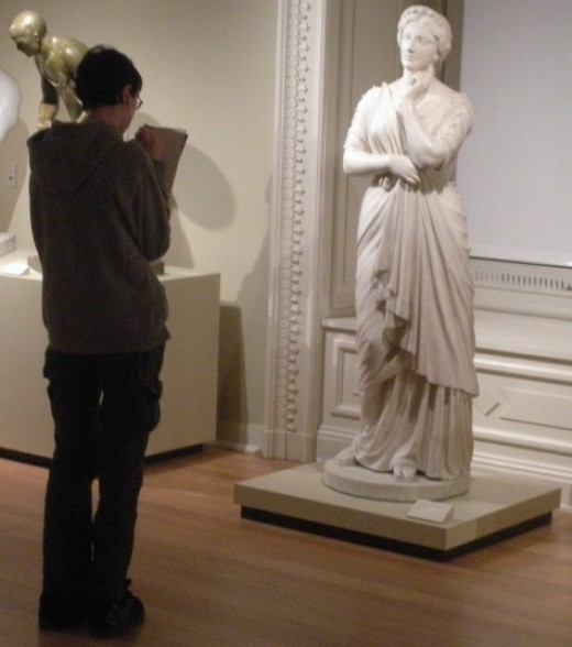 Here he is sketching Il Penseroso, a marble statue created by artist Joseph Mozier based on the allegorical figure of Melancholy in John Milton's 1632 poem of the same name.