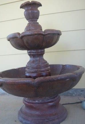 Using an epoxy or urethane based paint is durable especially for water in fountains and bird baths