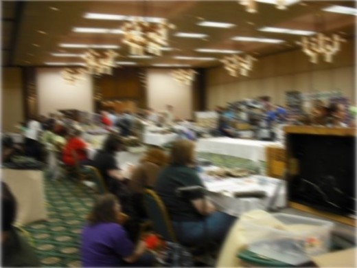 Fans in a convention dealers room. Image blurred to protect attendees' privacy.