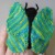 A butterfly finger puppet, knit with this colorway