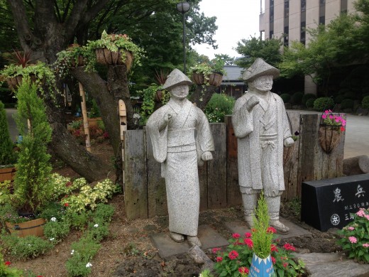 Statues outside a park.