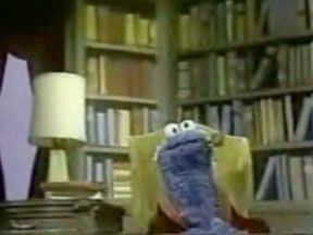 Alistair Cookie, played by Cookie Monster, appears with the disputed pipe