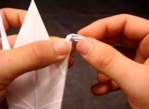 Folding an origami paper crane