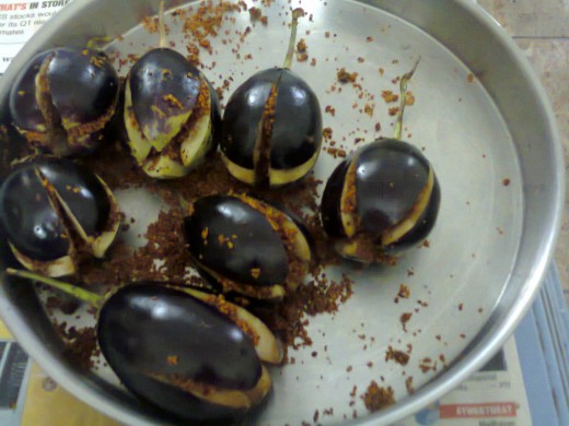 Brinjals filled with powder. Filling is shown in the video.