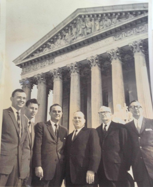 Gremillion (center) and legal team