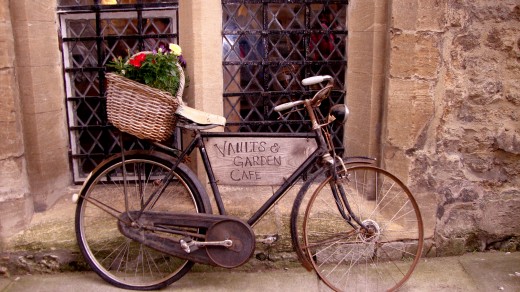 An antique bicycle parked out the town centre.